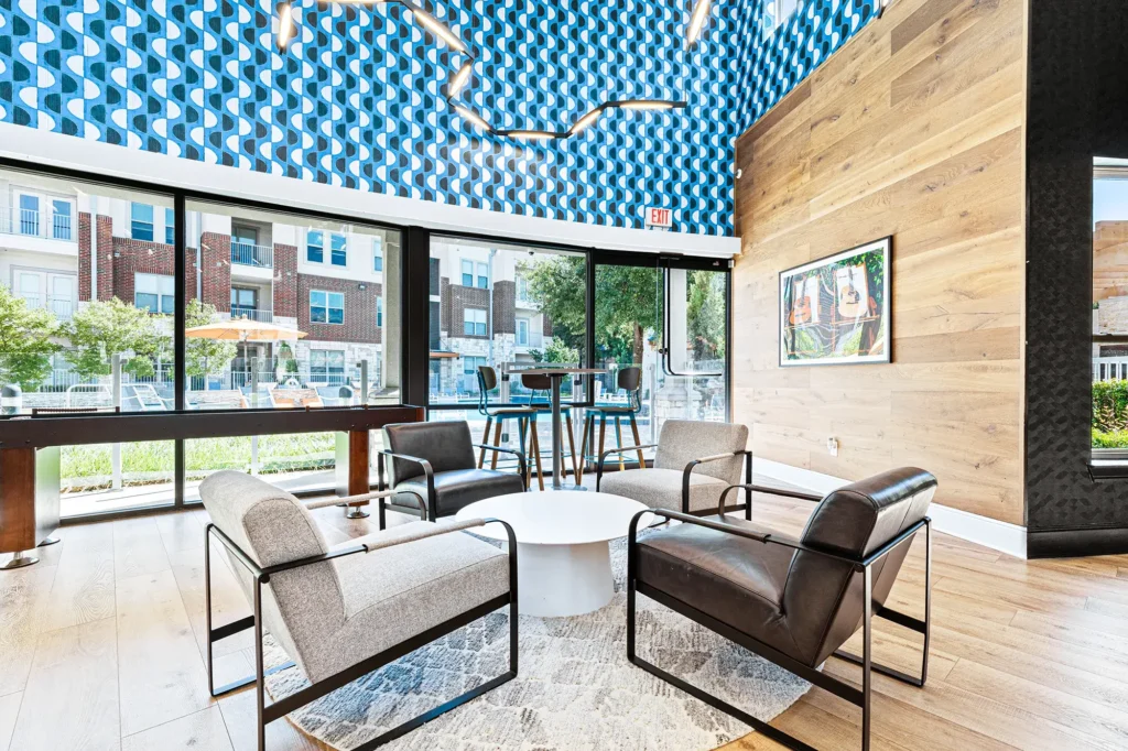 Clubhouse seating area with table and chairs and shuffleboard table