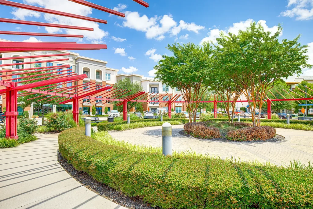 Outdoor green space with walking paths and landscaping