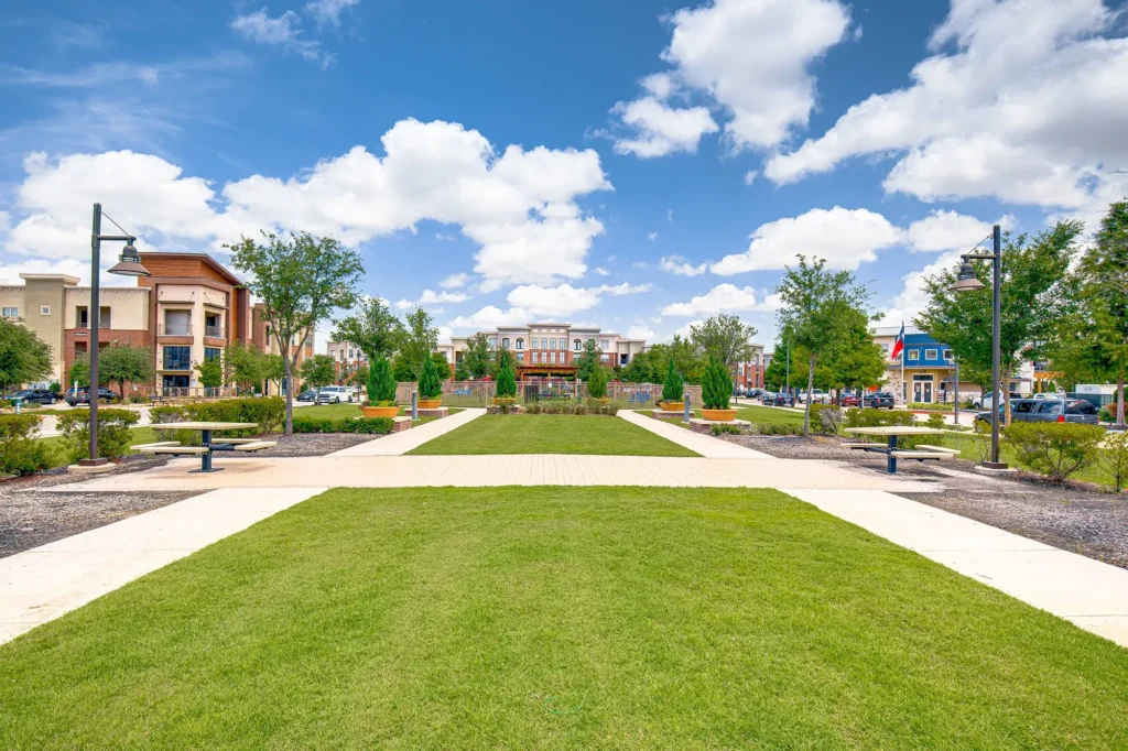 outdoor green space with walking paths and benches