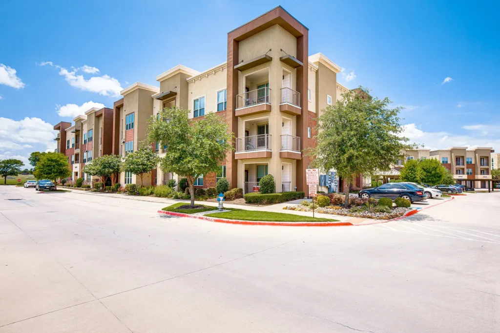Building exterior with lots of trees and lanscaping