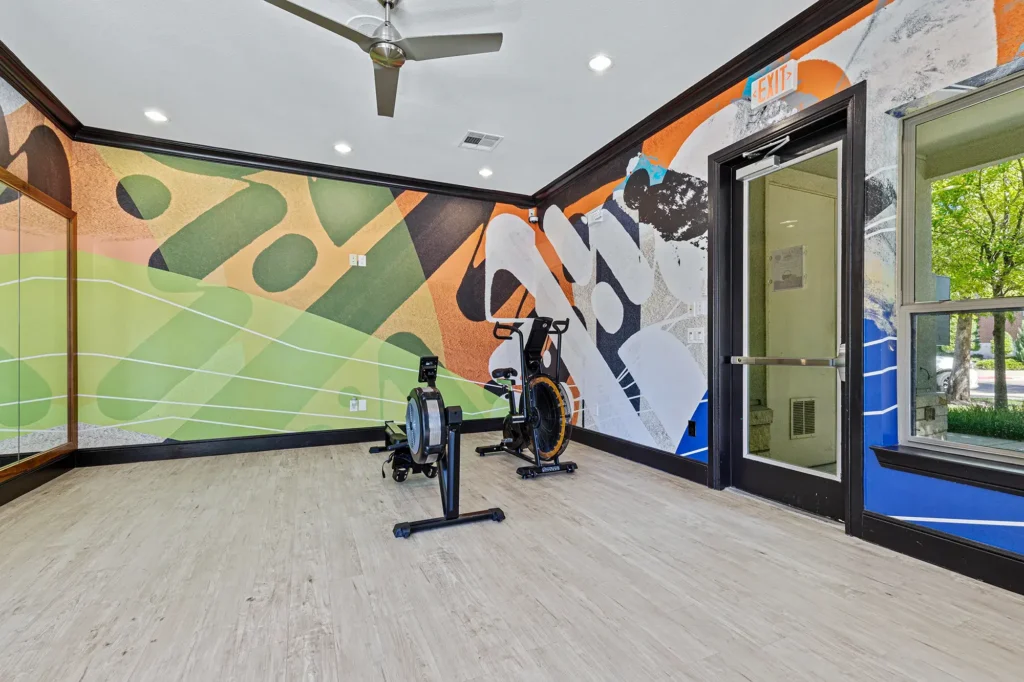 Fitness center with yoga and cardio room