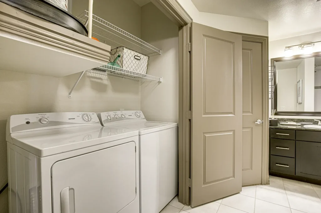 Laundry closet in a bathroom with washer and dryer
