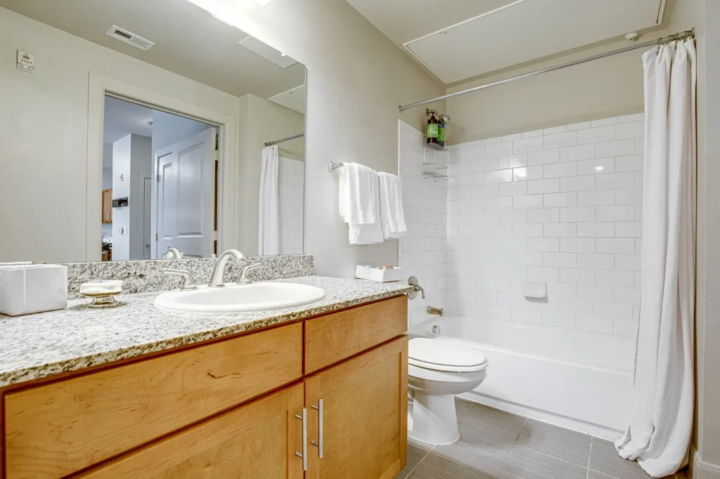 Bathroom with tub shower and toilet