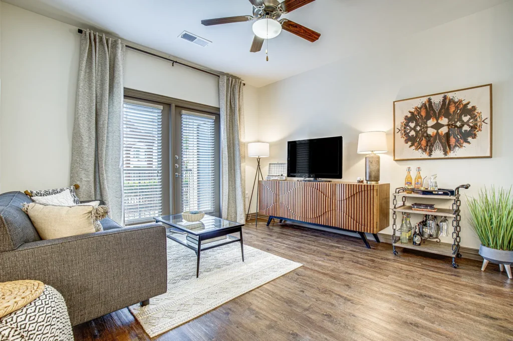 Open living room with patio doors and ceiling fan